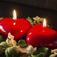Couple of red candles among the dried flowers
